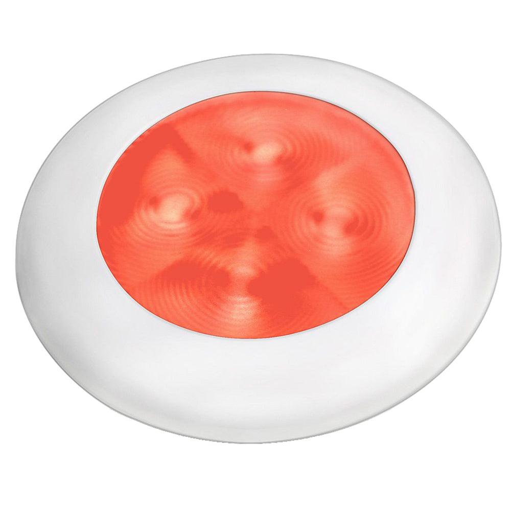 a red bowl filled with red liquid in a white bowl 