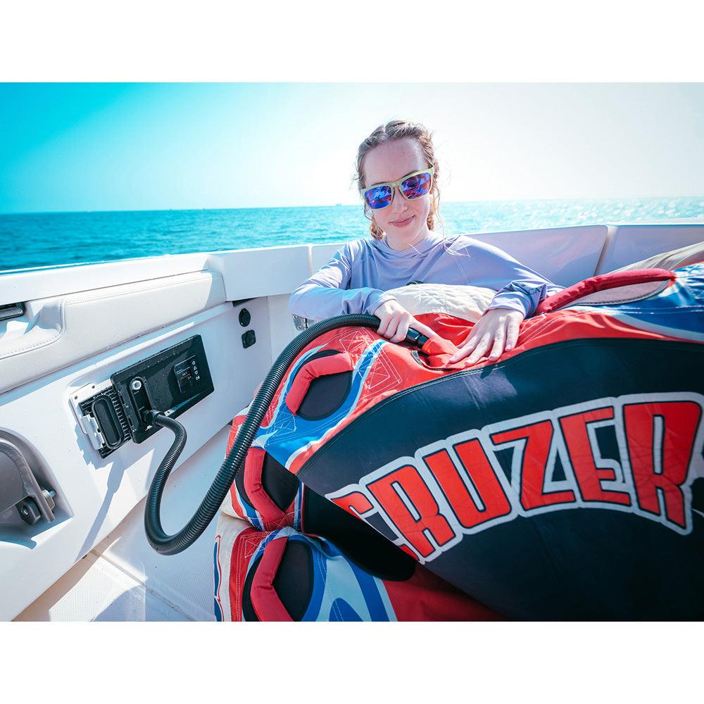 a man sitting on a boat in the ocean 